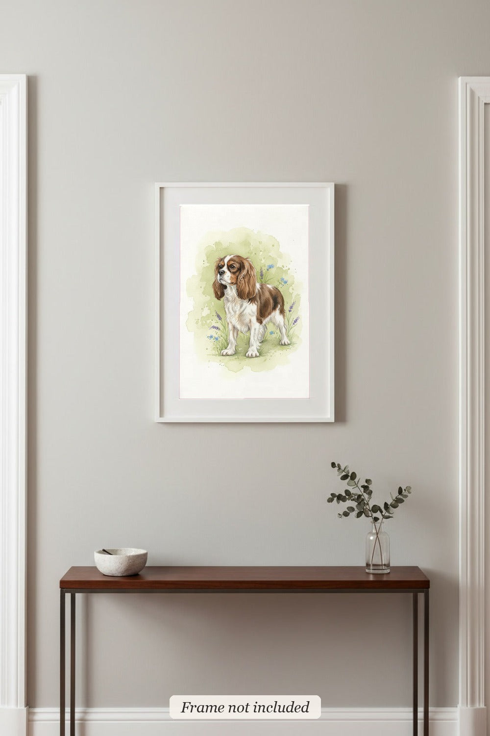 Blenheim - Cavalier King Charles Spaniel watercolour print in a slim white frame (frame not included) in an entrance hall