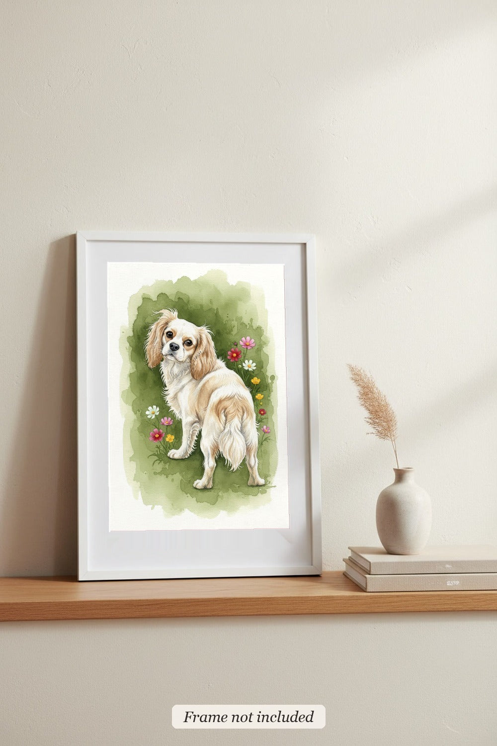 Light Blenheim - Cavalier King Charles Spaniel watercolour print in a slim white frame (frame not included), leaning on a picture ledge