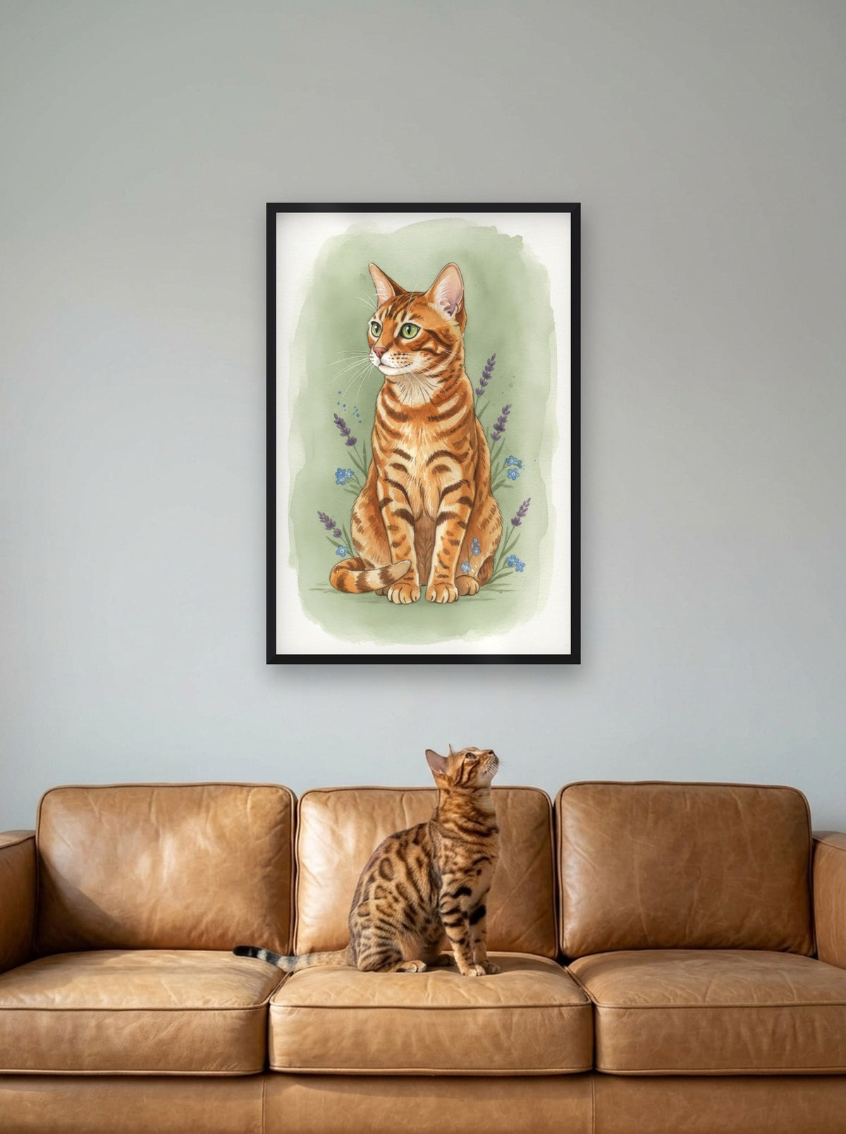 Brown Spotted - Bengal Cat watercolour-style print, framed on the wall above a bengal cat on a sofa (AI-generated photo)