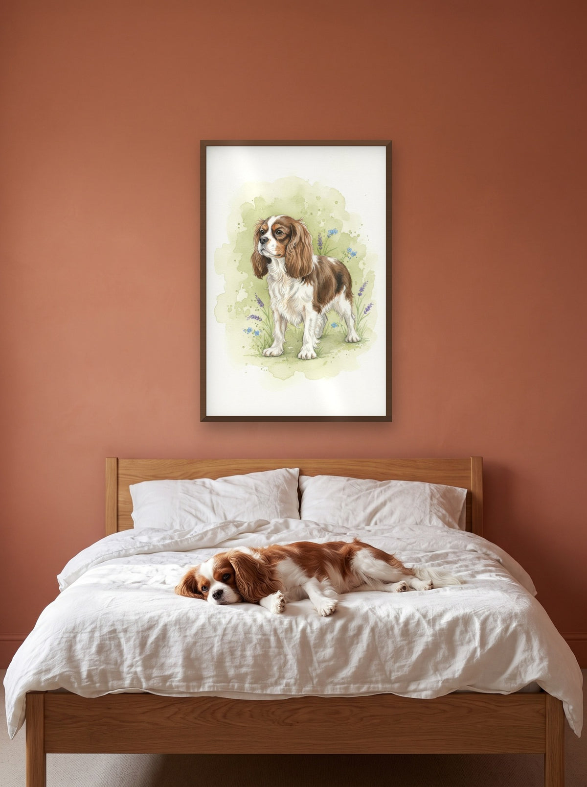 Blenheim - Cavalier King Charles Spaniel watercolour-style print, framed on the wall above a cavalier king charles spaniel on a bed (AI-generated photo)