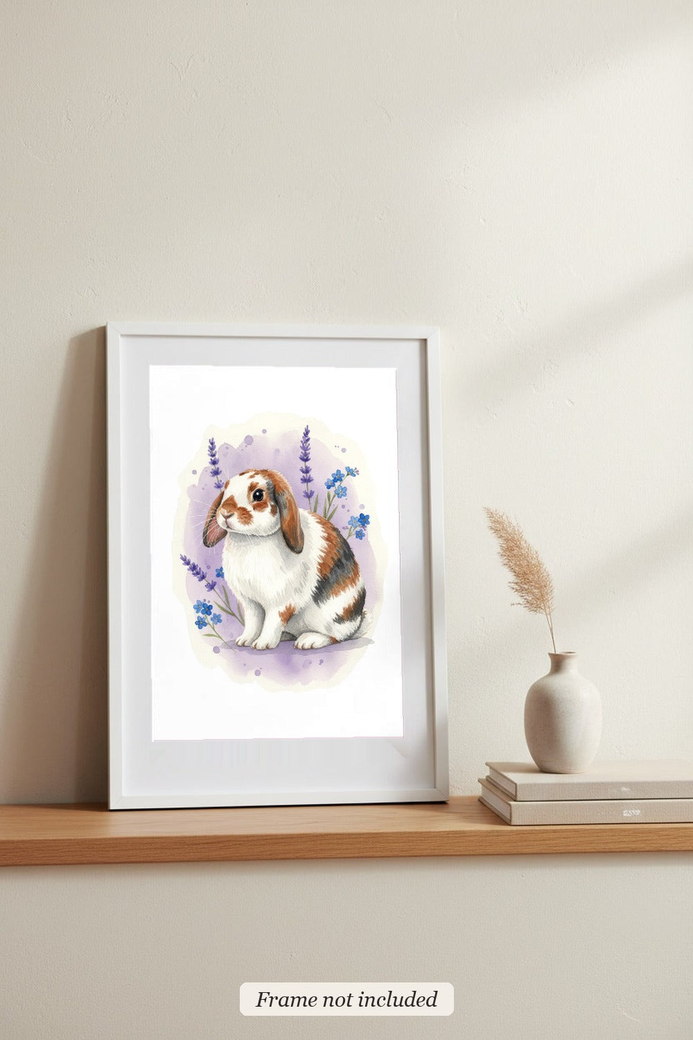 Broken - Holland Lop Rabbit watercolour print in a slim white frame (frame not included), leaning on a picture ledge